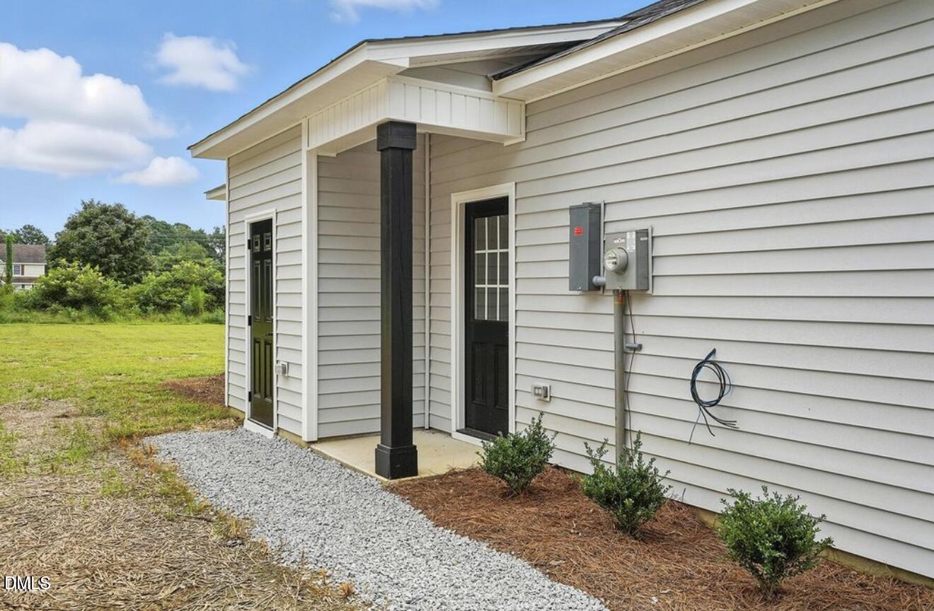 1240 West Blackman Road Dunn, NC 28334 - Photo 23 of 25 a view of a house with a yard and stairs