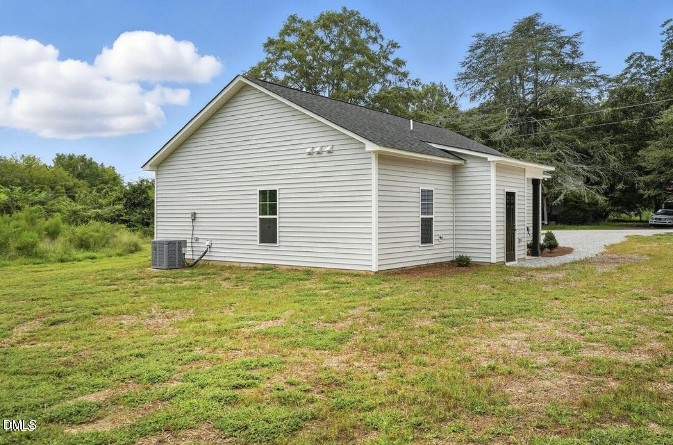 1240 West Blackman Road Dunn, NC 28334 - Photo 24 of 25 a view of a house with a yard