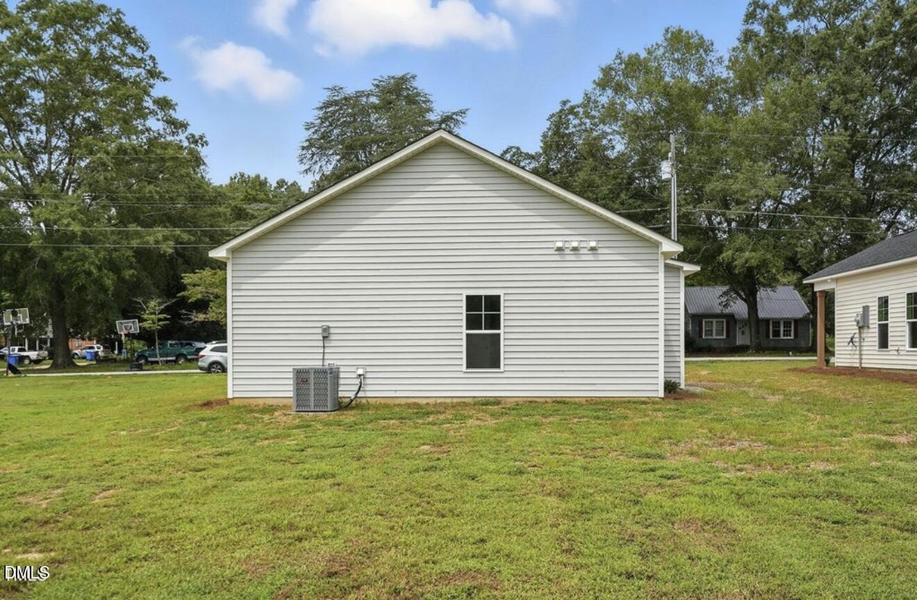 1240 West Blackman Road Dunn, NC 28334 - Photo 25 of 25 a view of a house with a yard