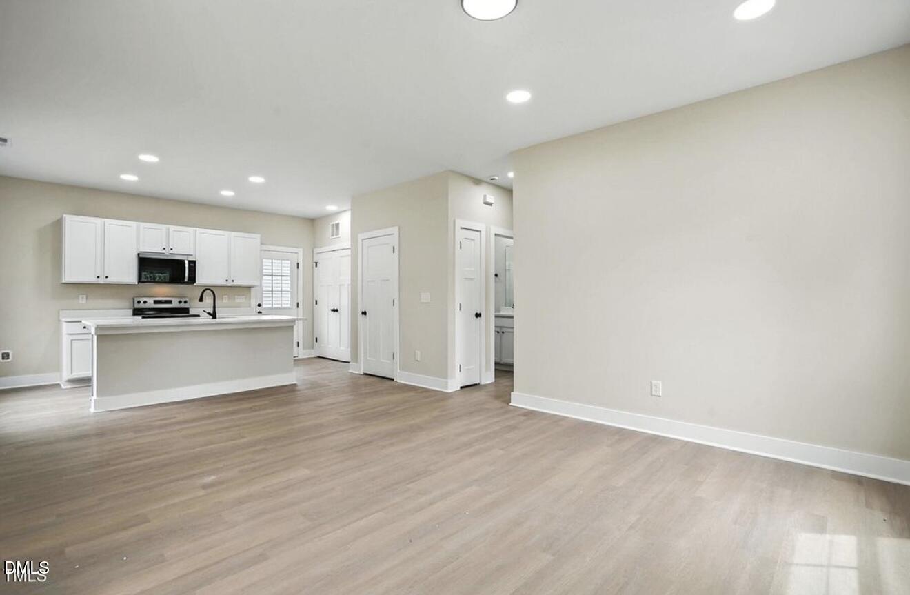 1240 West Blackman Road Dunn, NC 28334 - Photo 8 of 25 a view of kitchen with microwave and cabinets