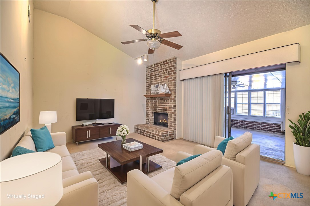 4000 Hickory Road, Unit 3 Temple, TX 76502 - Photo 15 of 34 a living room with furniture a flat screen tv and a large window