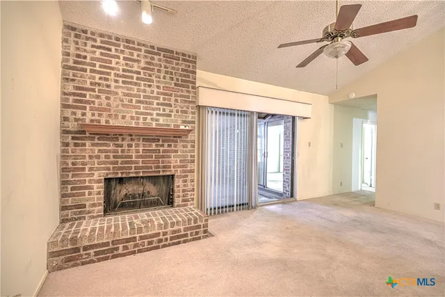 a living room with a fireplace