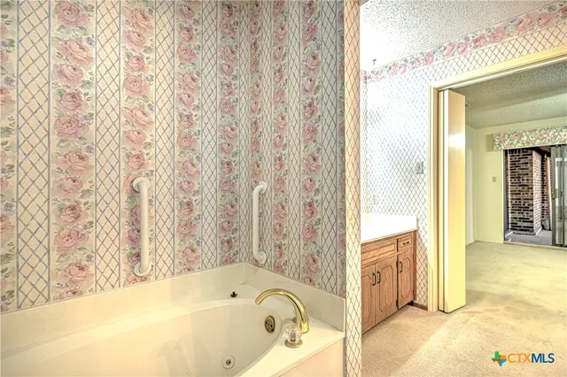 a bathroom with a tub and shower