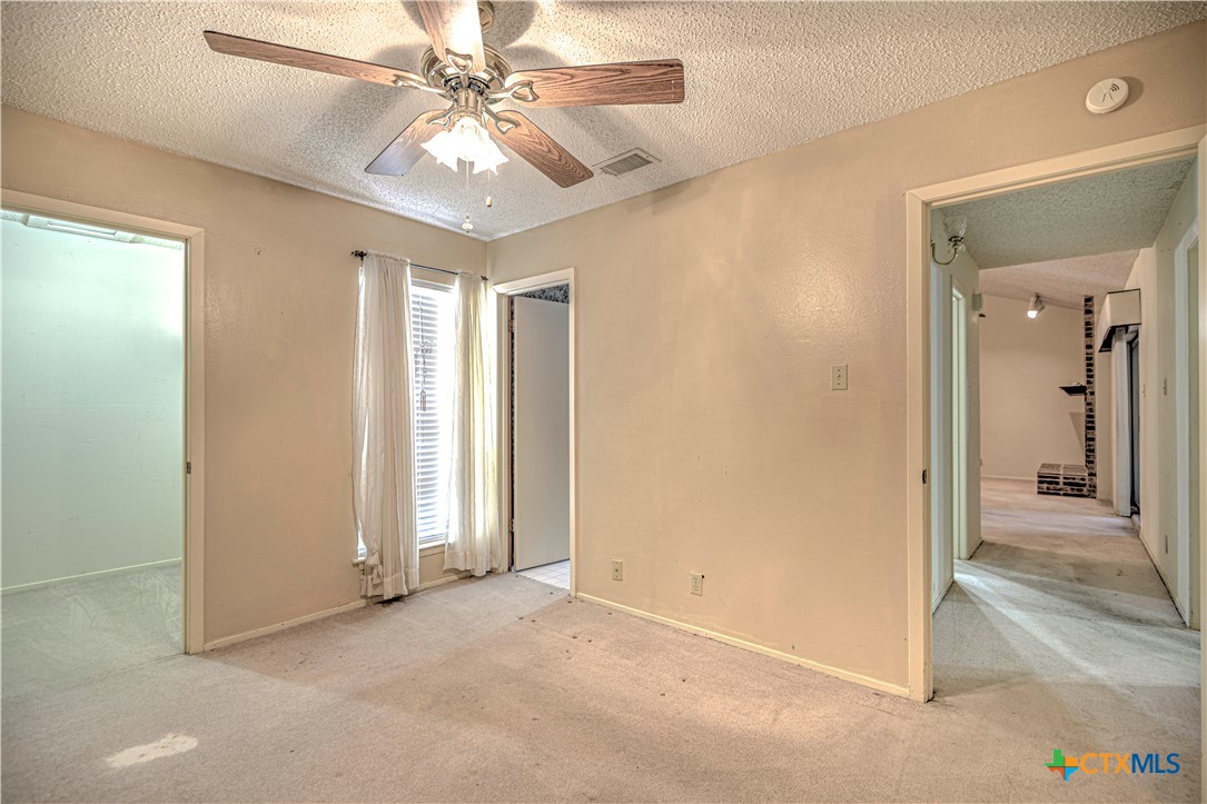 4000 Hickory Road, Unit 3 Temple, TX 76502 - Photo 28 of 34 an empty room with windows and fan