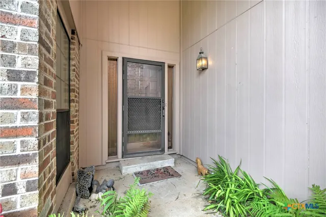 a house with a plant in front of it