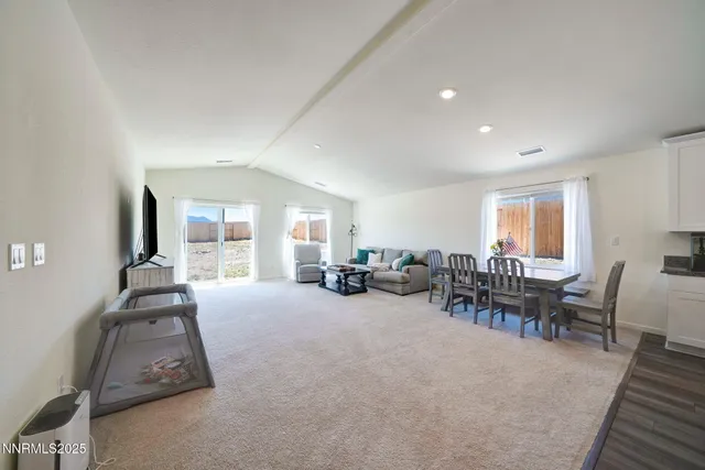 a view of a livingroom with furniture and a window