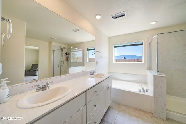 a bathroom with a bathtub a shower a toilet and sink