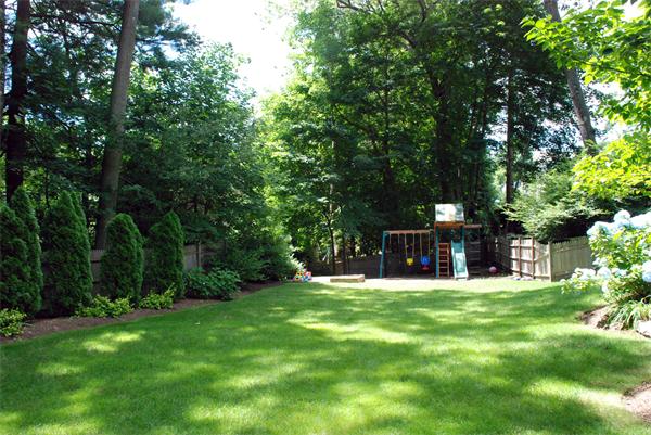 43 River Glen Road Wellesley, MA 02481 - Photo 3 of 20 a view of a house with a yard