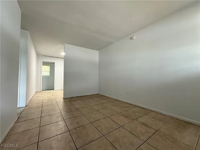 a view of an empty room and window