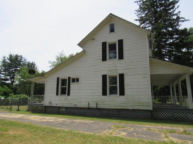 270 Wilpen Road Ligonier, PA 15658 - Photo 16 of 20 a front view of a house with a yard
