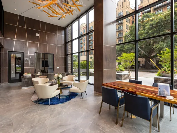 a room with pool table and windows