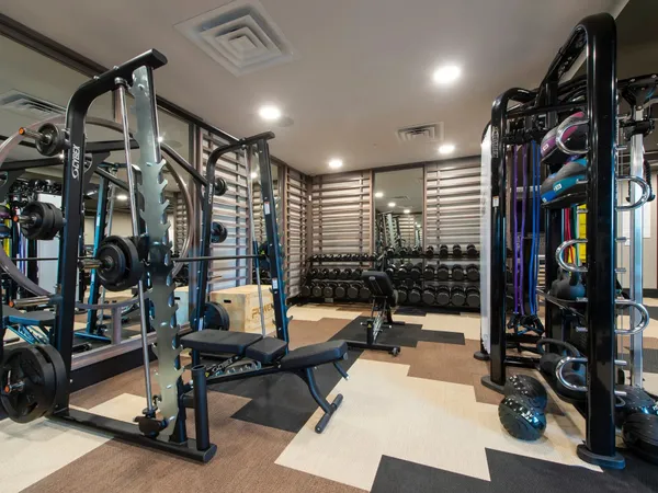 a living room with lots of furniture and a rug