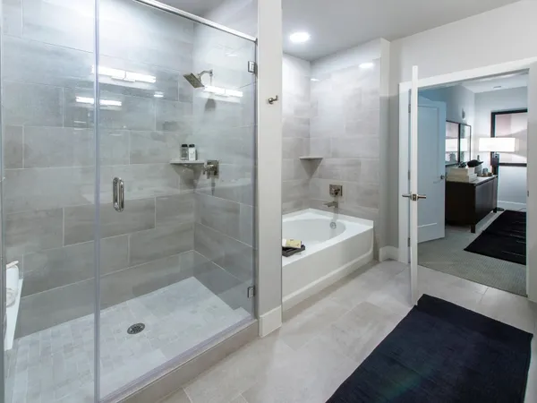 a bathroom with a bathtub and a shower