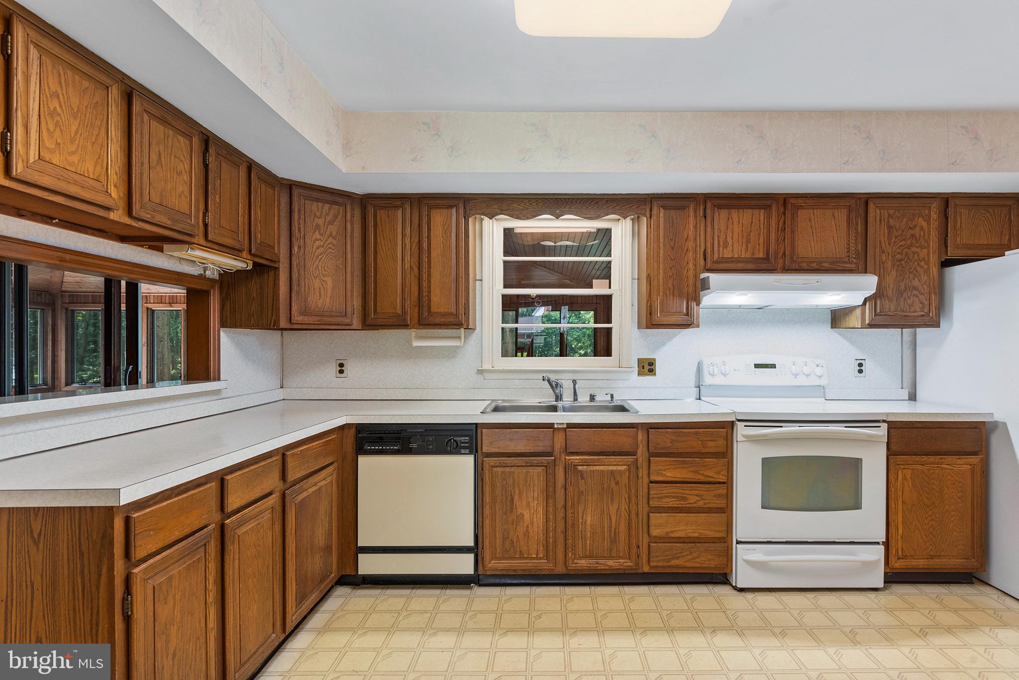 316 Caravel Drive Bear, DE 19701 - Photo 11 of 47 a kitchen with a sink stove and cabinets