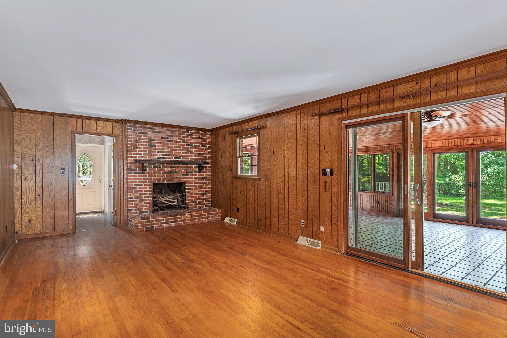 316 Caravel Drive Bear, DE 19701 - Photo 12 of 47 wooden floor fireplace and windows in an empty room