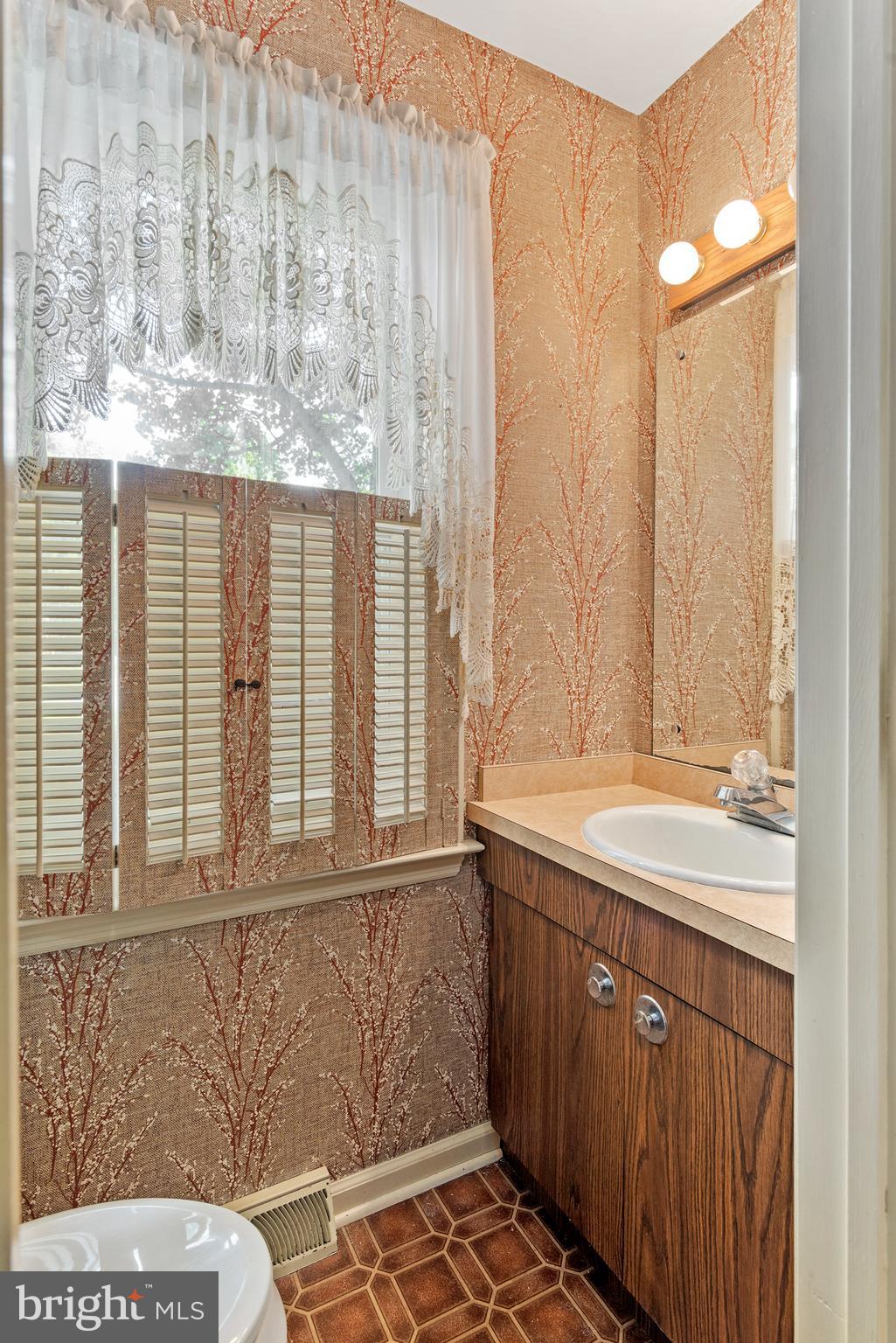 316 Caravel Drive Bear, DE 19701 - Photo 16 of 47 a bathroom with a sink and a mirror