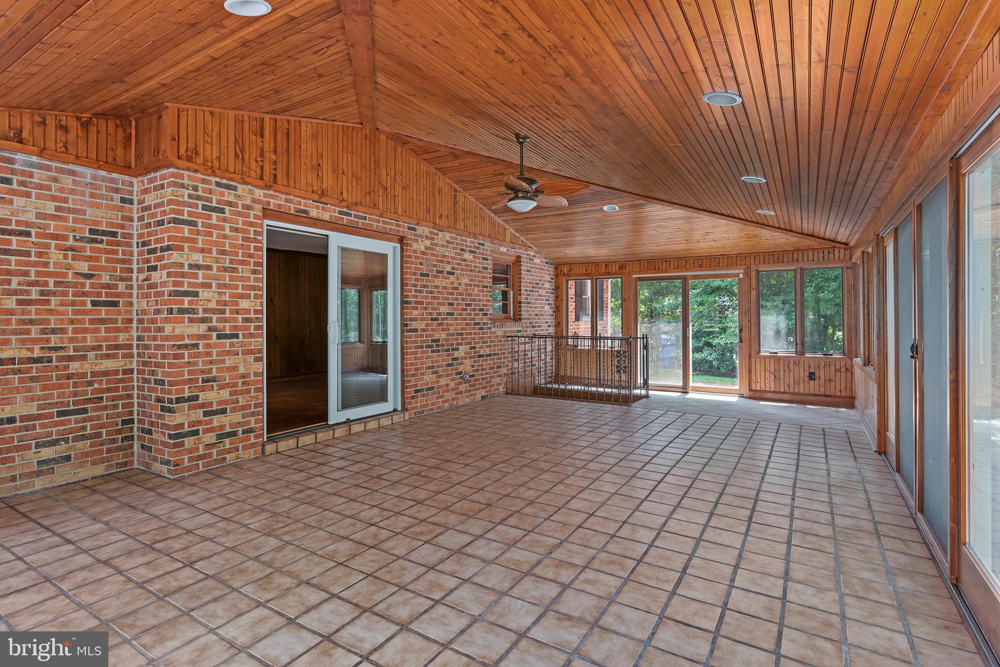 316 Caravel Drive Bear, DE 19701 - Photo 17 of 47 a view of a porch with wooden floor and iron fence