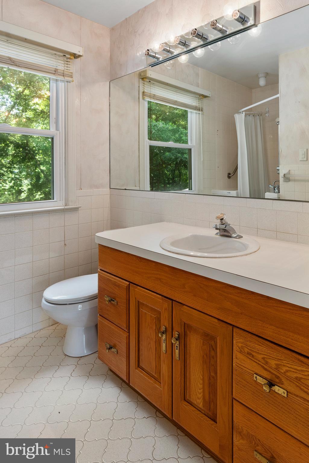 316 Caravel Drive Bear, DE 19701 - Photo 22 of 47 a bathroom with a toilet sink and mirror