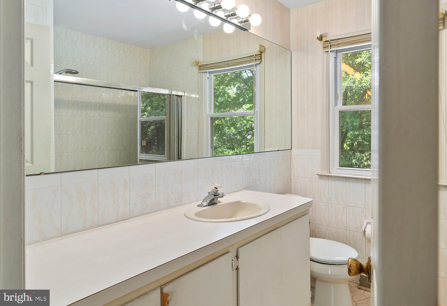 316 Caravel Drive Bear, DE 19701 - Photo 24 of 47 a bathroom with a sink toilet and a mirror