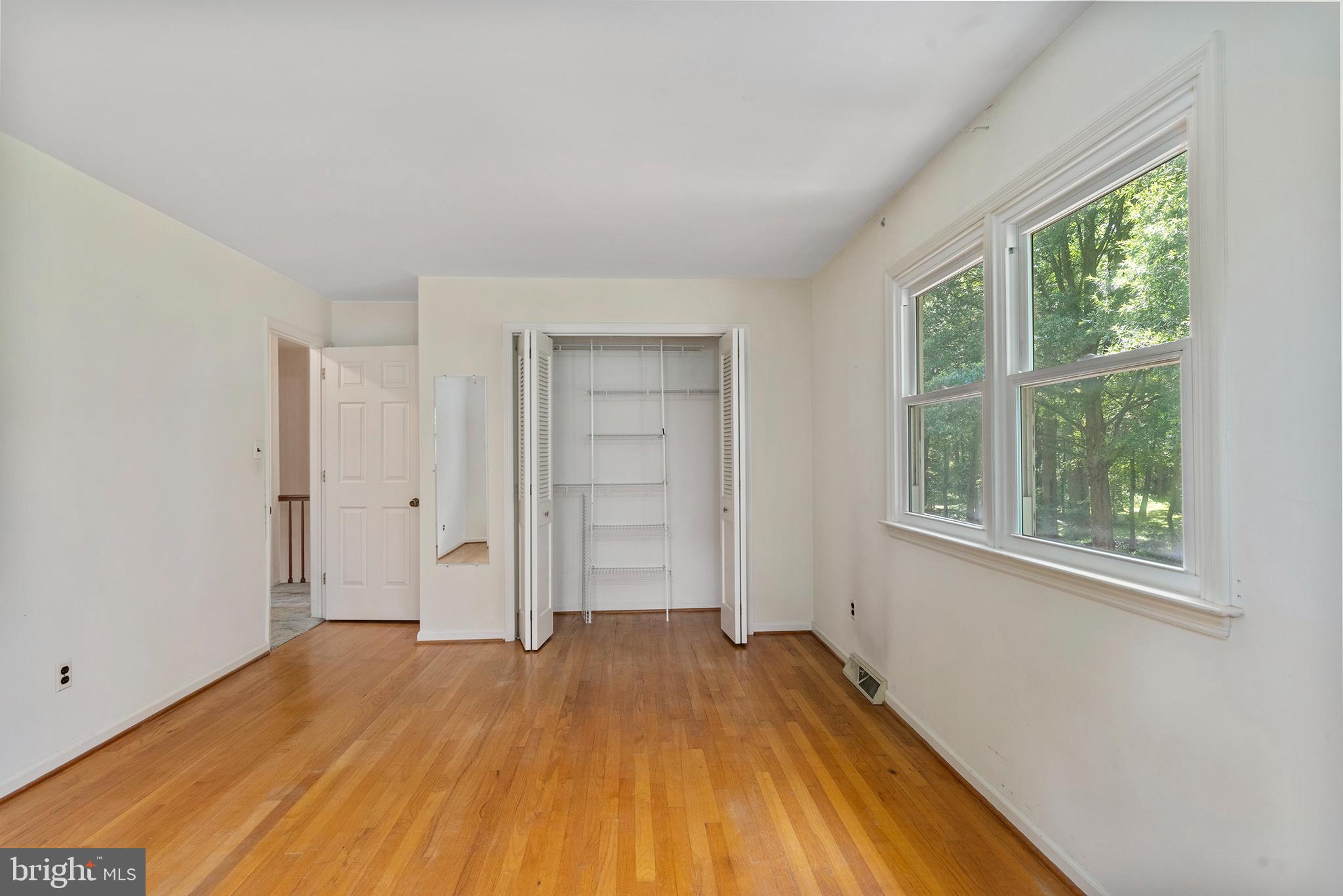 316 Caravel Drive Bear, DE 19701 - Photo 30 of 47 a view of empty room with wooden floor and fan
