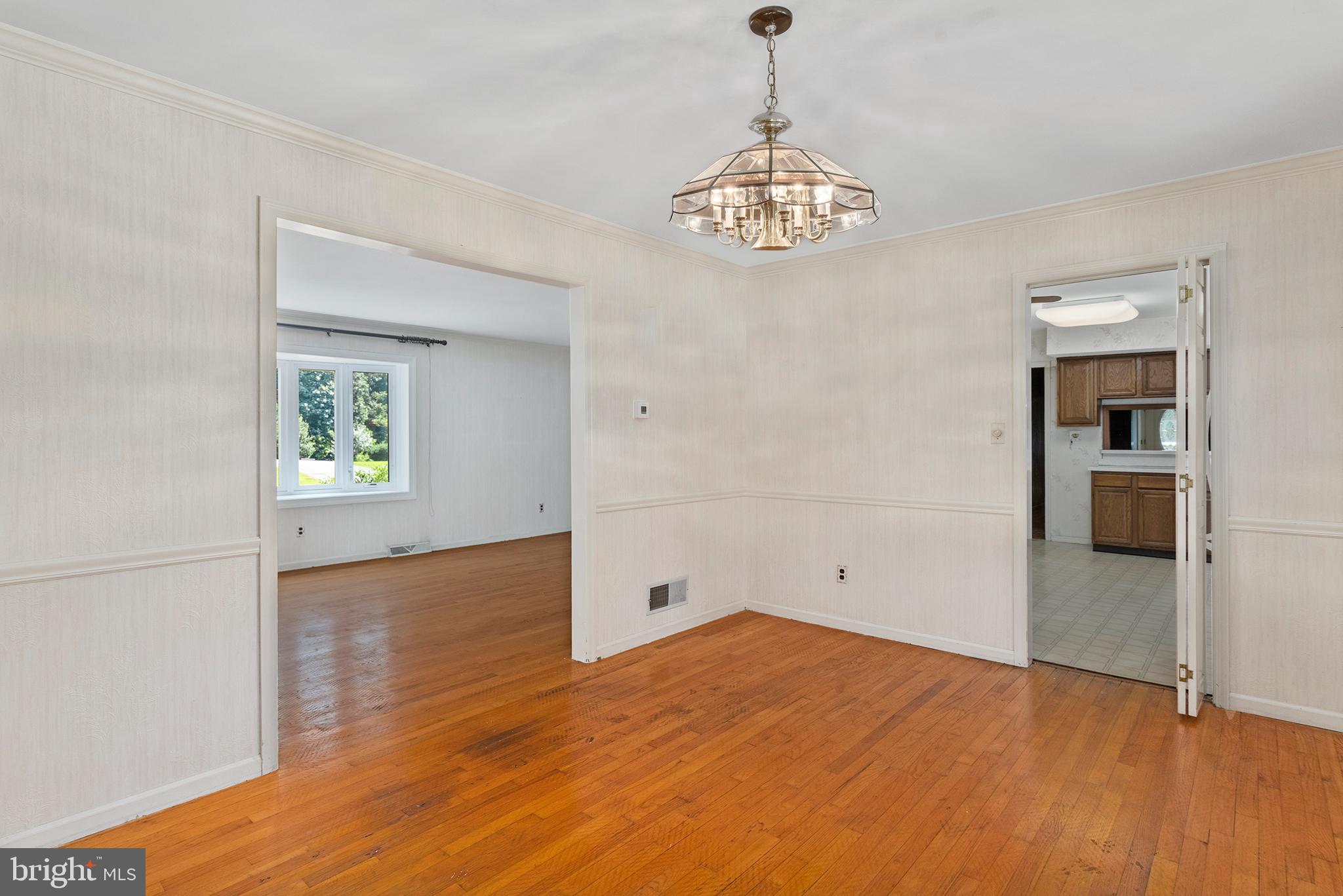 316 Caravel Drive Bear, DE 19701 - Photo 7 of 47 a view of empty room with wooden floor