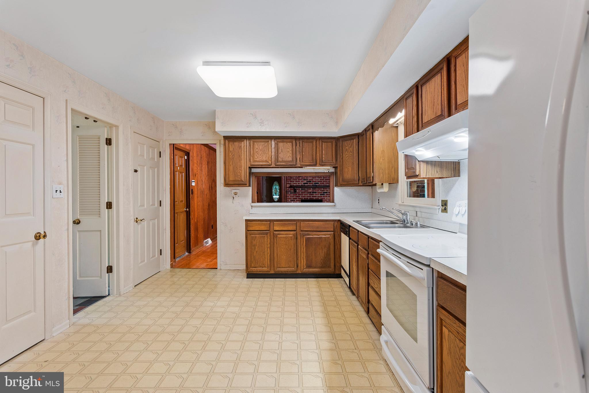 316 Caravel Drive Bear, DE 19701 - Photo 8 of 47 a large kitchen with stainless steel appliances granite countertop a stove and a refrigerator