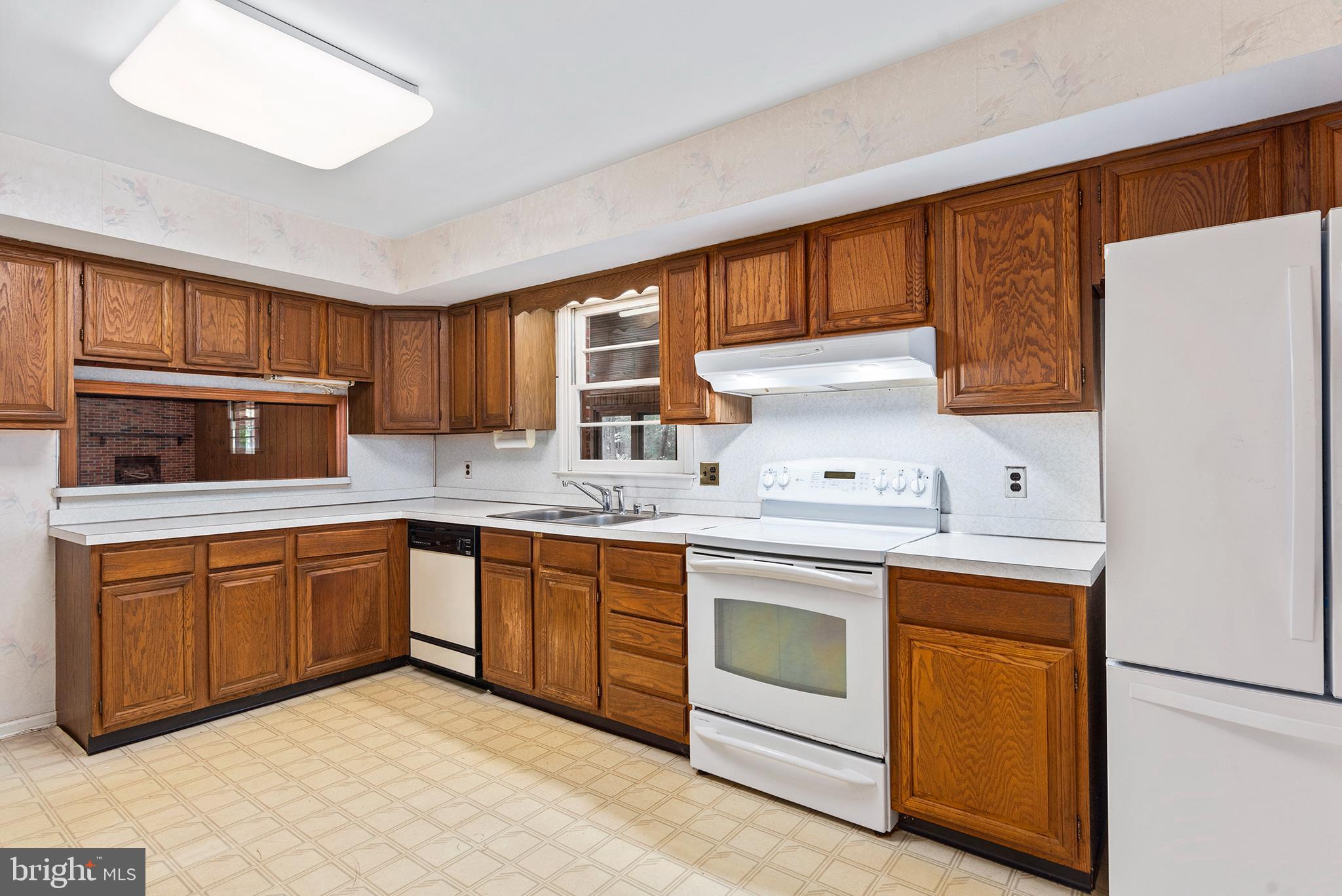 316 Caravel Drive Bear, DE 19701 - Photo 9 of 47 a kitchen with granite countertop cabinets stainless steel appliances and a sink
