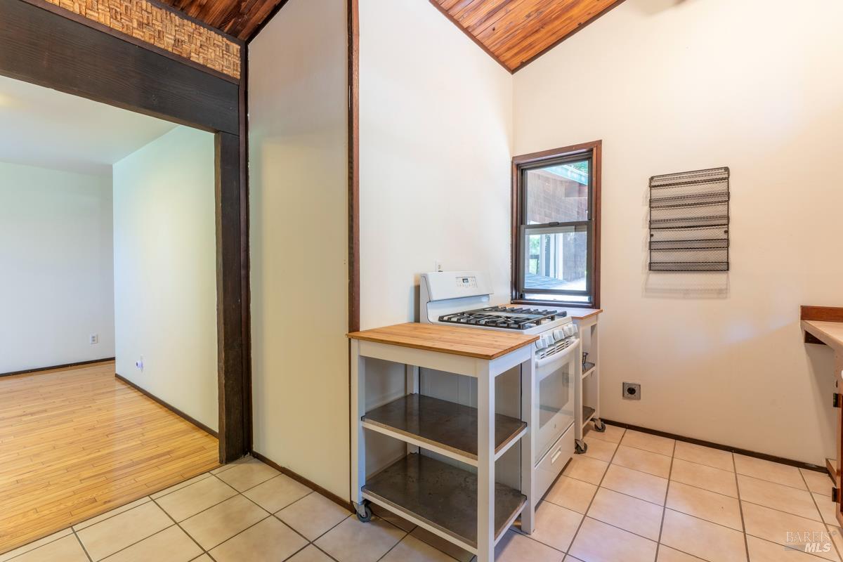 32371 Middle Ridge Road Albion, CA 95410 - Photo 11 of 35 a kitchen with a stove and a refrigerator