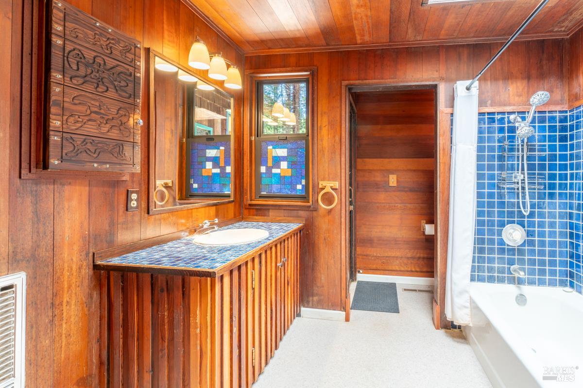 32371 Middle Ridge Road Albion, CA 95410 - Photo 15 of 35 a bathroom with a tub sink and mirror