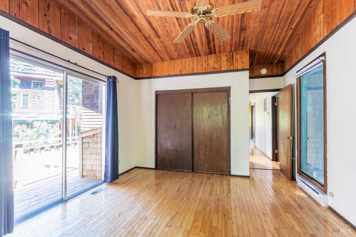 32371 Middle Ridge Road Albion, CA 95410 - Photo 17 of 35 a view of empty room with wooden floor and fan