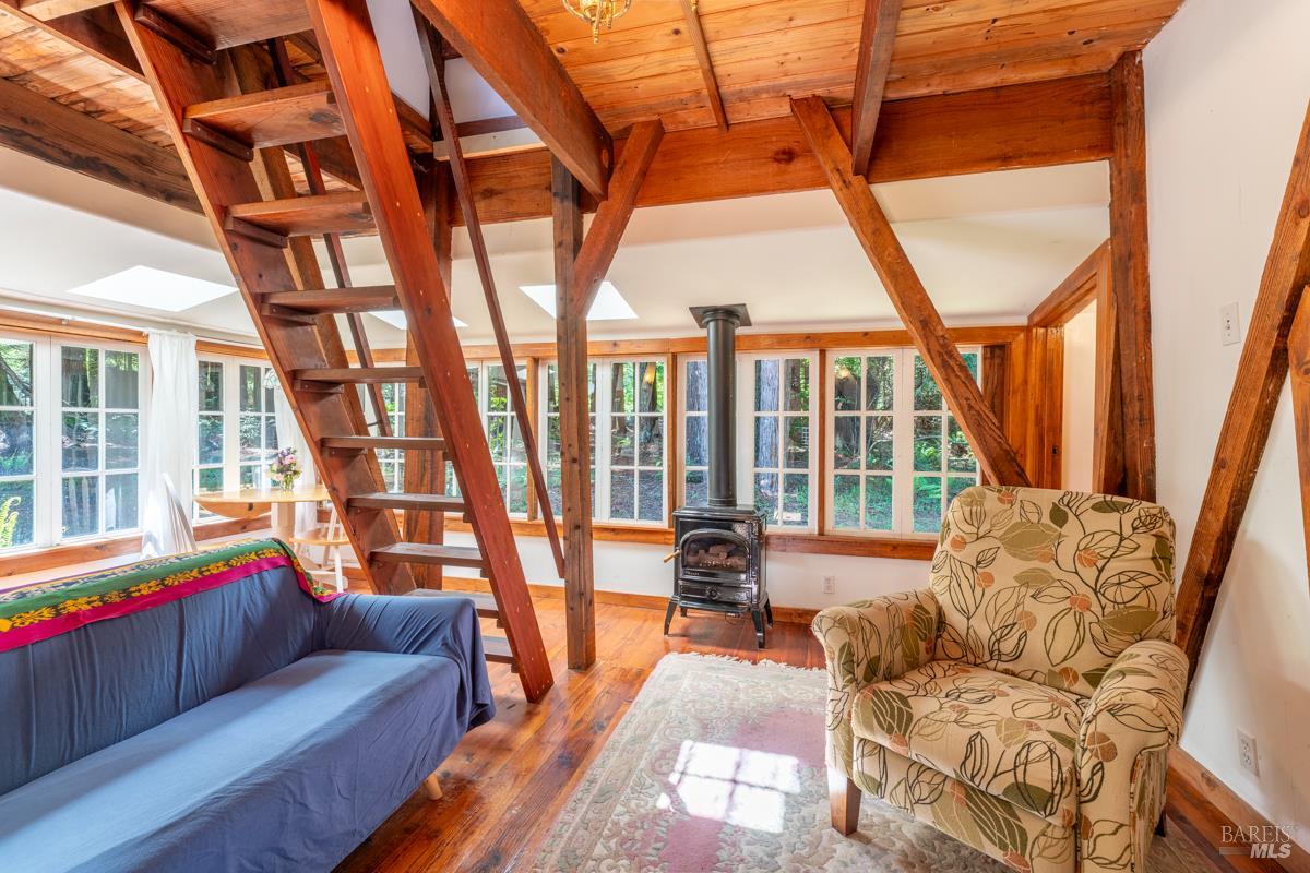 32371 Middle Ridge Road Albion, CA 95410 - Photo 20 of 35 a living room with furniture and a large window