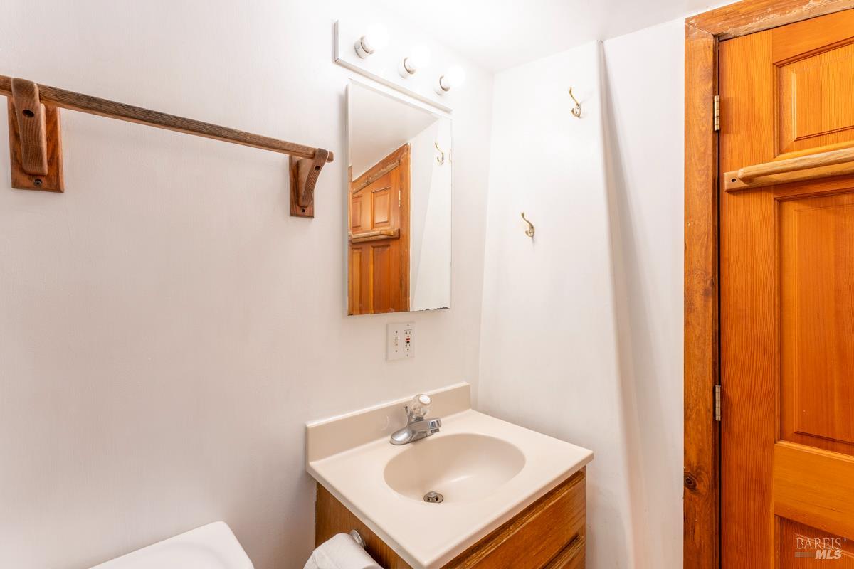 32371 Middle Ridge Road Albion, CA 95410 - Photo 24 of 35 a bathroom with a sink a mirror and a shower