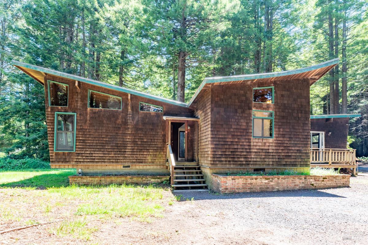 32371 Middle Ridge Road Albion, CA 95410 - Photo 5 of 35 a front view of a house with a yard