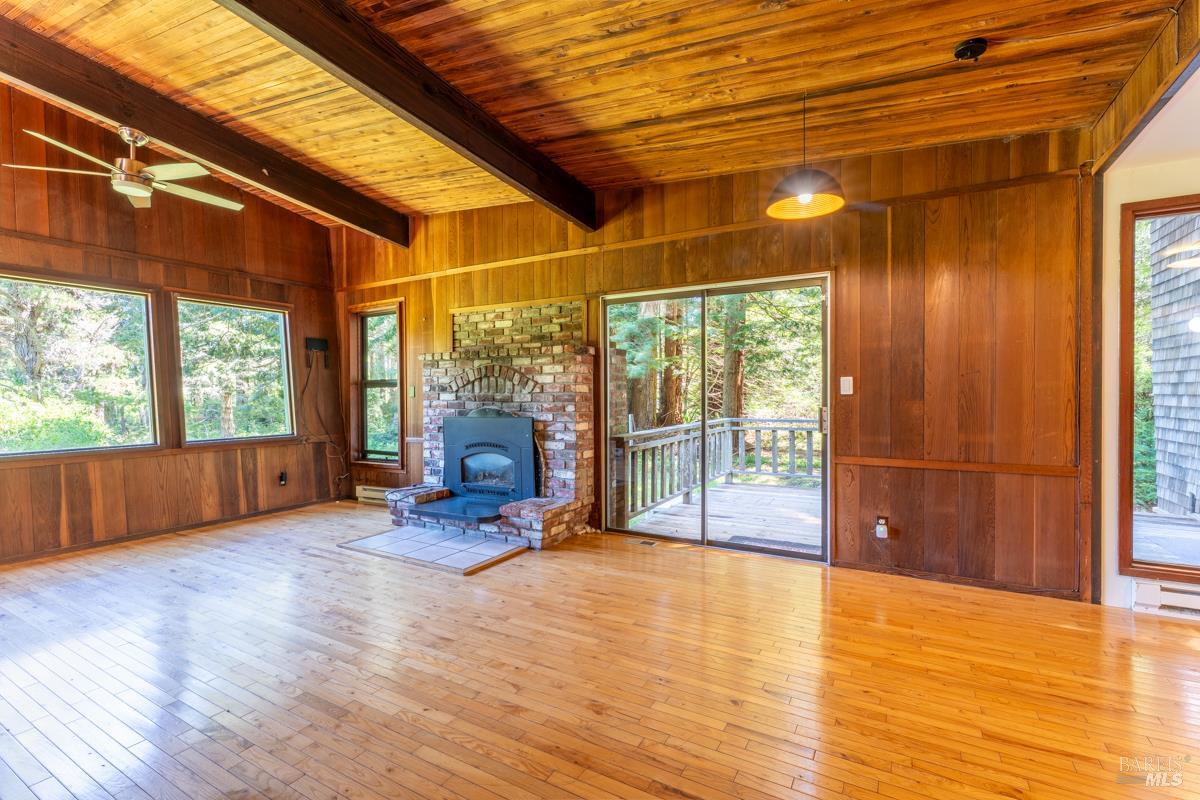 32371 Middle Ridge Road Albion, CA 95410 - Photo 6 of 35 a view of a room with wooden floor and iron stairs