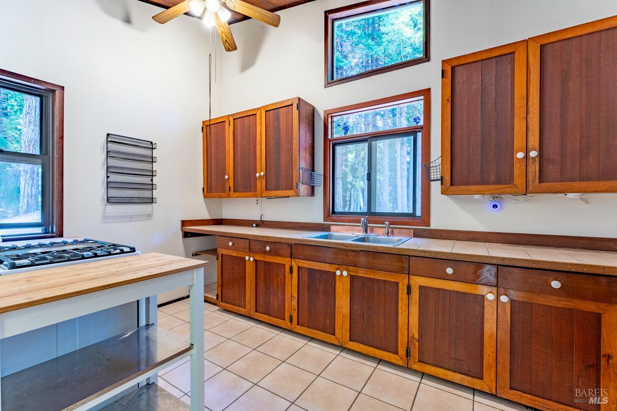 32371 Middle Ridge Road Albion, CA 95410 - Photo 10 of 35 a kitchen with stainless steel appliances a sink stove and cabinets