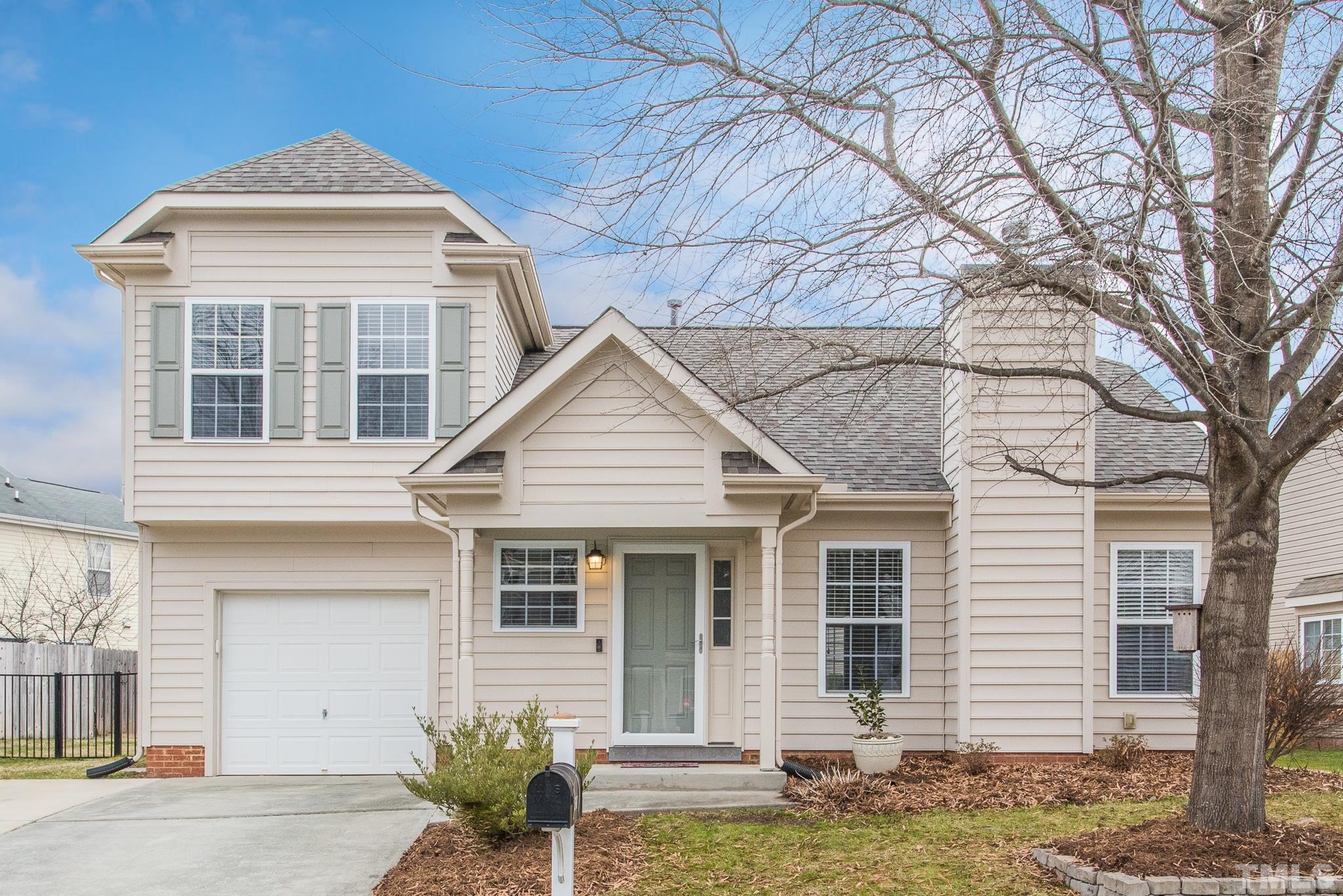 1307 Mallory Lane Durham, NC 27713 - Photo 1 of 29 a front view of a house with garden