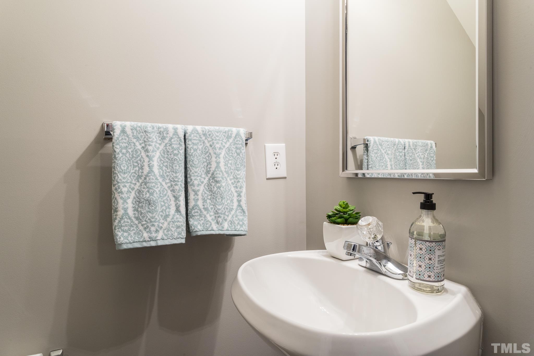 1307 Mallory Lane Durham, NC 27713 - Photo 23 of 29 a bathroom with a sink and a mirror