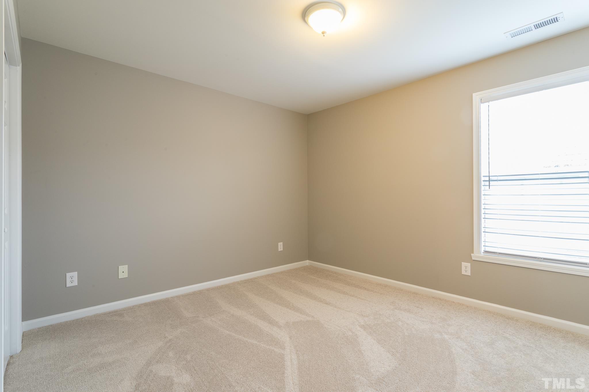 1307 Mallory Lane Durham, NC 27713 - Photo 25 of 29 a view of an empty room with a window