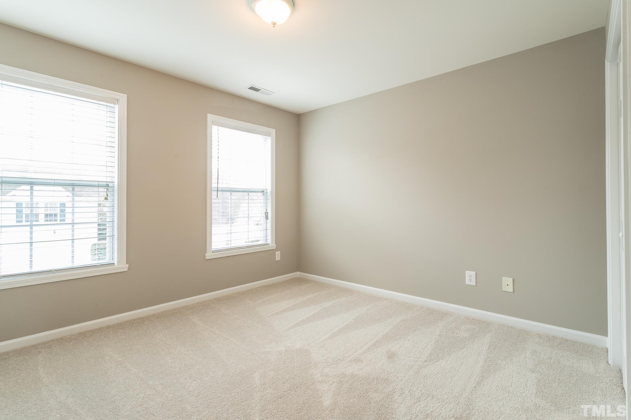 1307 Mallory Lane Durham, NC 27713 - Photo 28 of 29 an empty room with a window