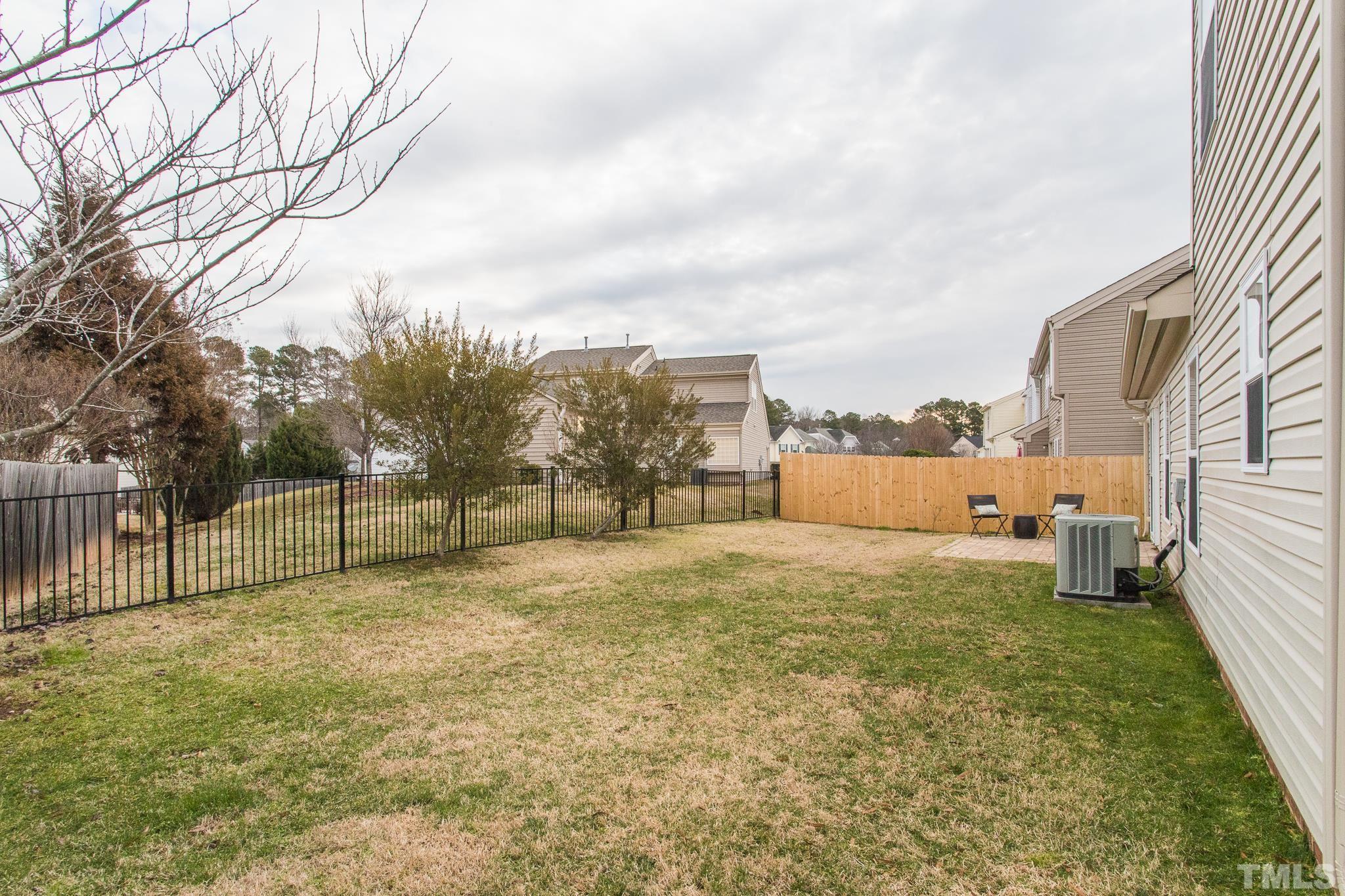 1307 Mallory Lane Durham, NC 27713 - Photo 5 of 29 a view of a yard with a large tree