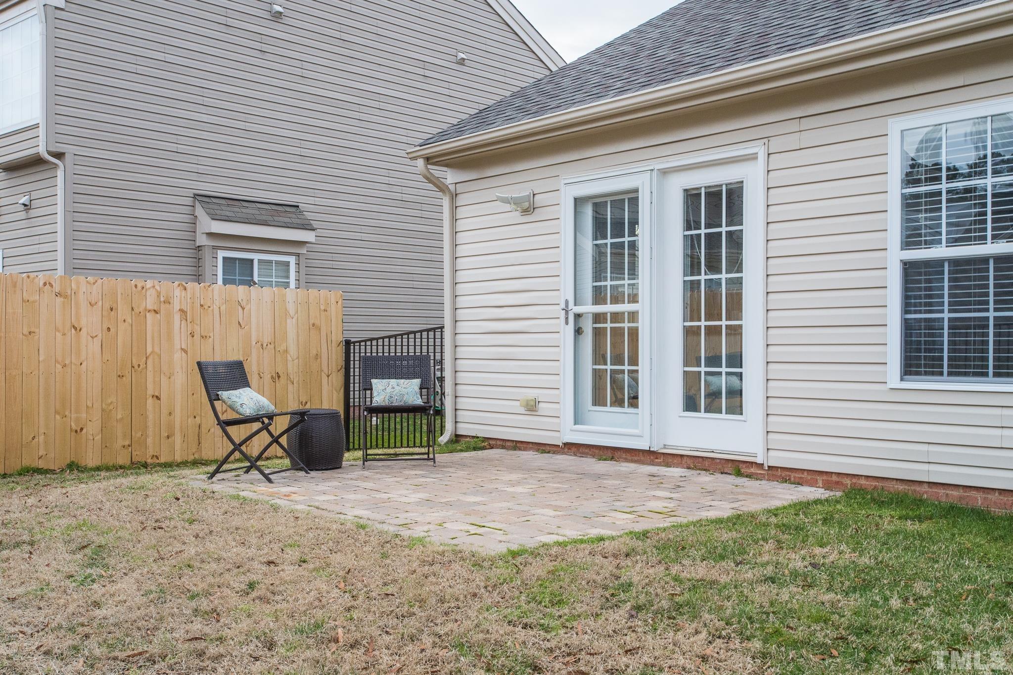 1307 Mallory Lane Durham, NC 27713 - Photo 7 of 29 a view of a house with backyard and chair