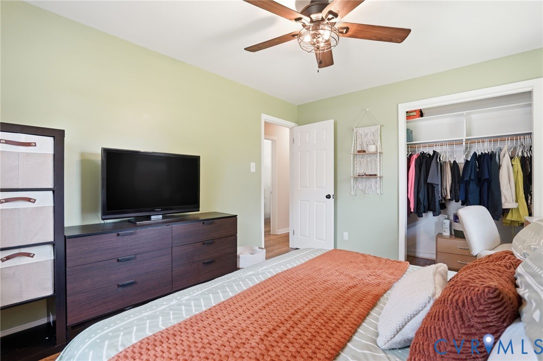 2403 Omega Road Henrico, VA 23228 - Photo 17 of 39 a bedroom with a bed and a flat tv screen on dresser