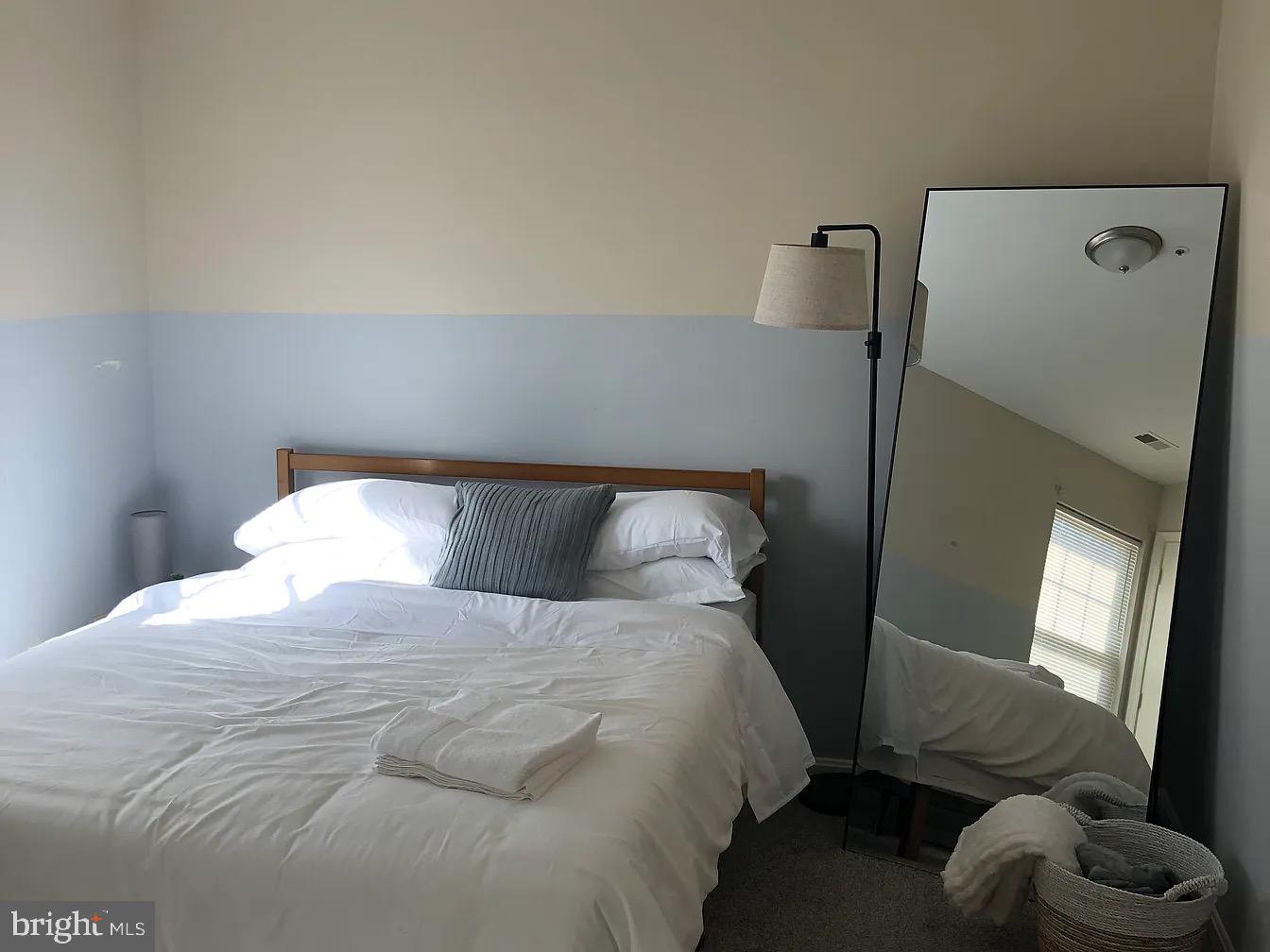 2 Catalpa Court Baltimore, MD 21209 - Photo 14 of 20 a large bed sitting in a bedroom next to a window