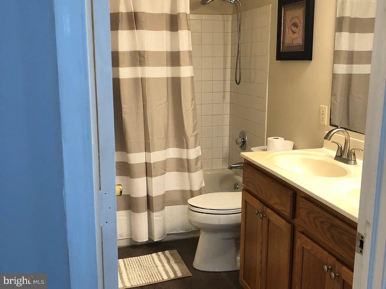 2 Catalpa Court Baltimore, MD 21209 - Photo 17 of 20 a bathroom with a sink a toilet and shower