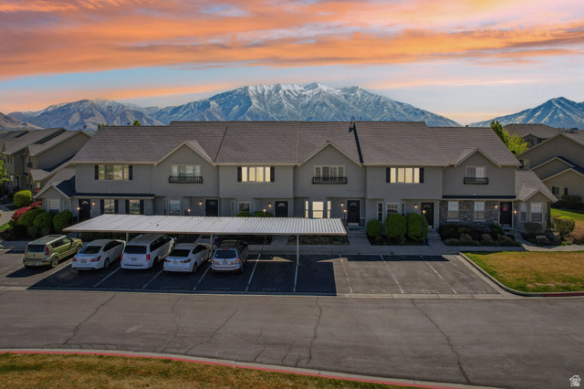 1077 South 1850th Street West Springville, UT 84663 - Photo 1 of 22 Property at dusk featuring a mountain view and covered and uncovered parking