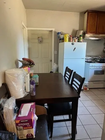 a kitchen with a stove a sink and a microwave