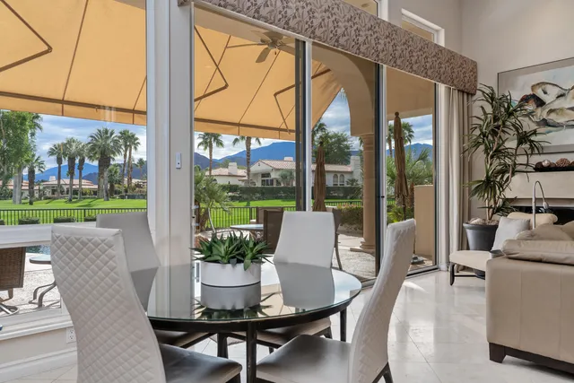 a dining room with furniture wooden floor and a potted plants
