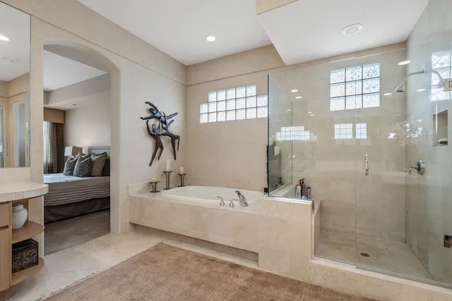 a bathroom with a bathtub and a shower