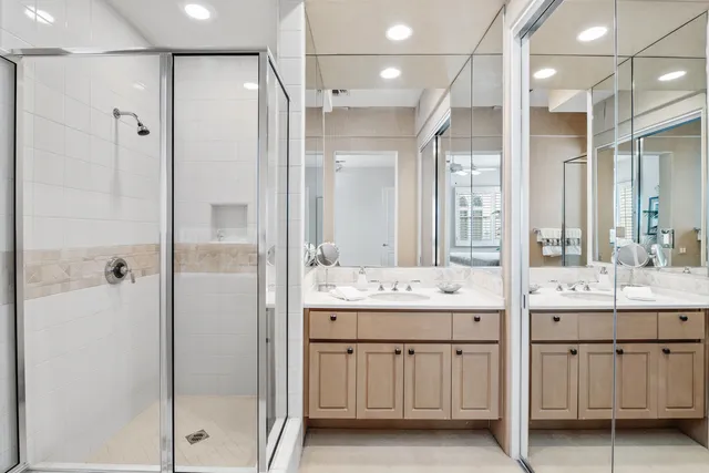 a bathroom with a double vanity sink mirror and double