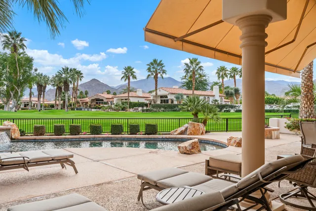 a view of a swimming pool with a patio